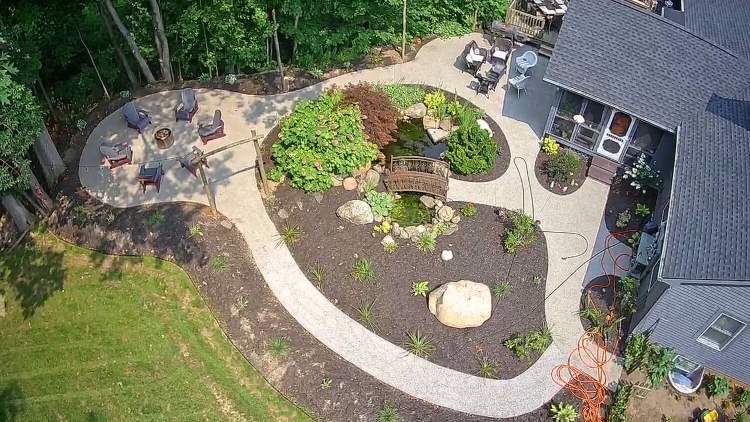 Concrete — Curved concrete walkway and fire-pit patio by MST Construction