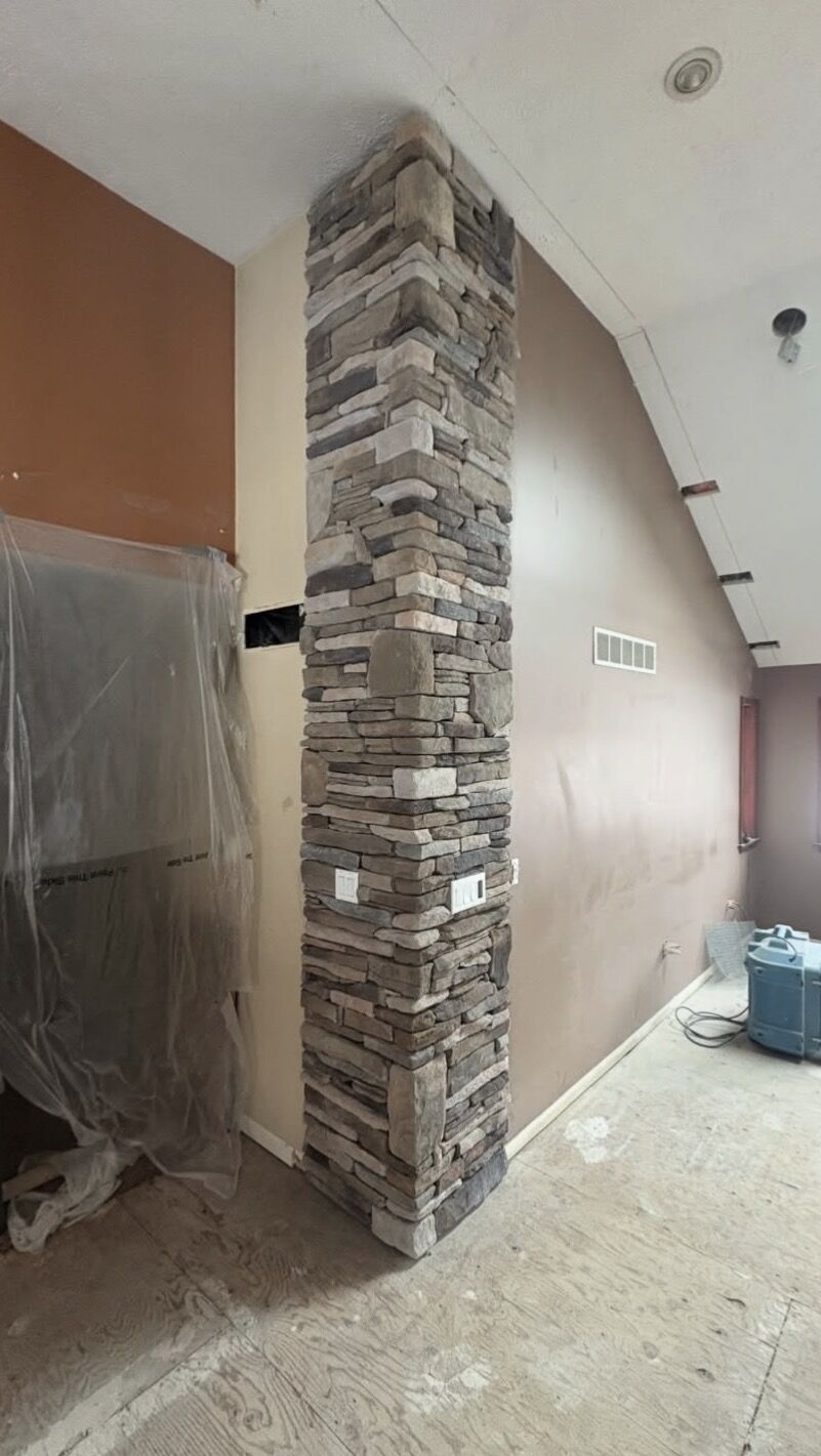Stonework — Full-height ledgestone column by MST Construction