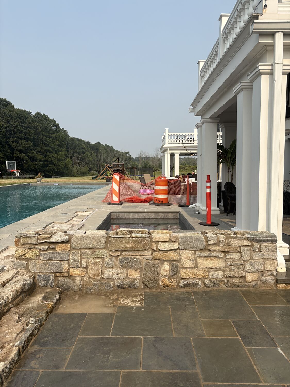 Stonework — Stone seat wall and bluestone patio by MST Construction
