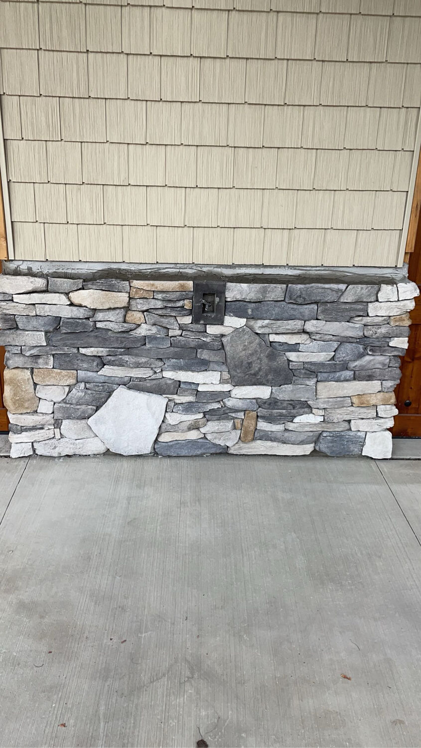 Stonework — Natural stone veneer wainscot by MST Construction